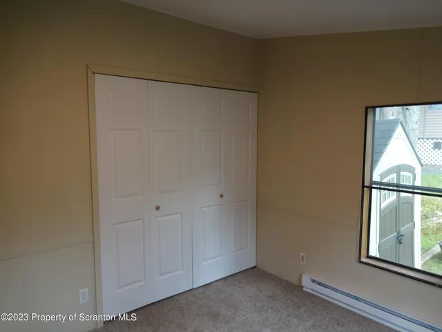 a bathroom with a toilet and a bath tub