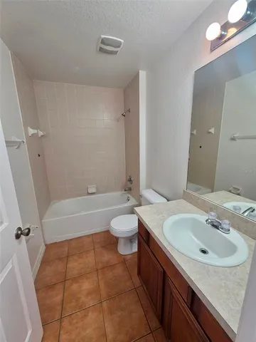 a bathroom with a sink a toilet and a bathtub