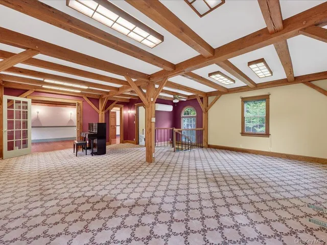 a view of a porch with a table and chairs