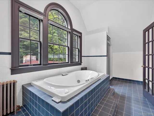 a bathroom with a sink toilet and a mirror
