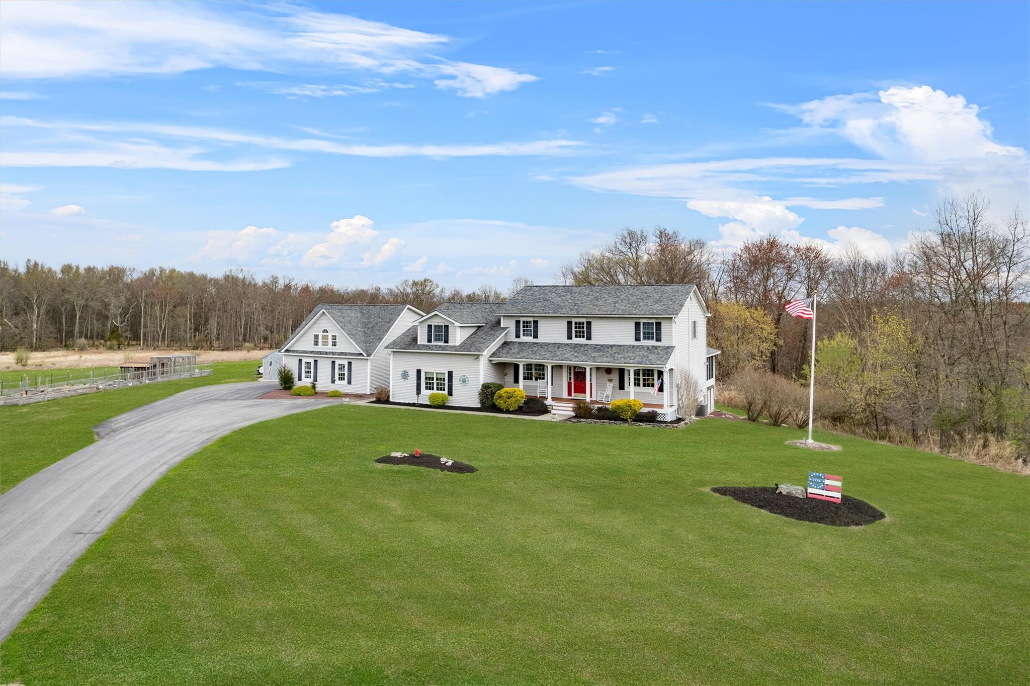 a view of a house with a big yard