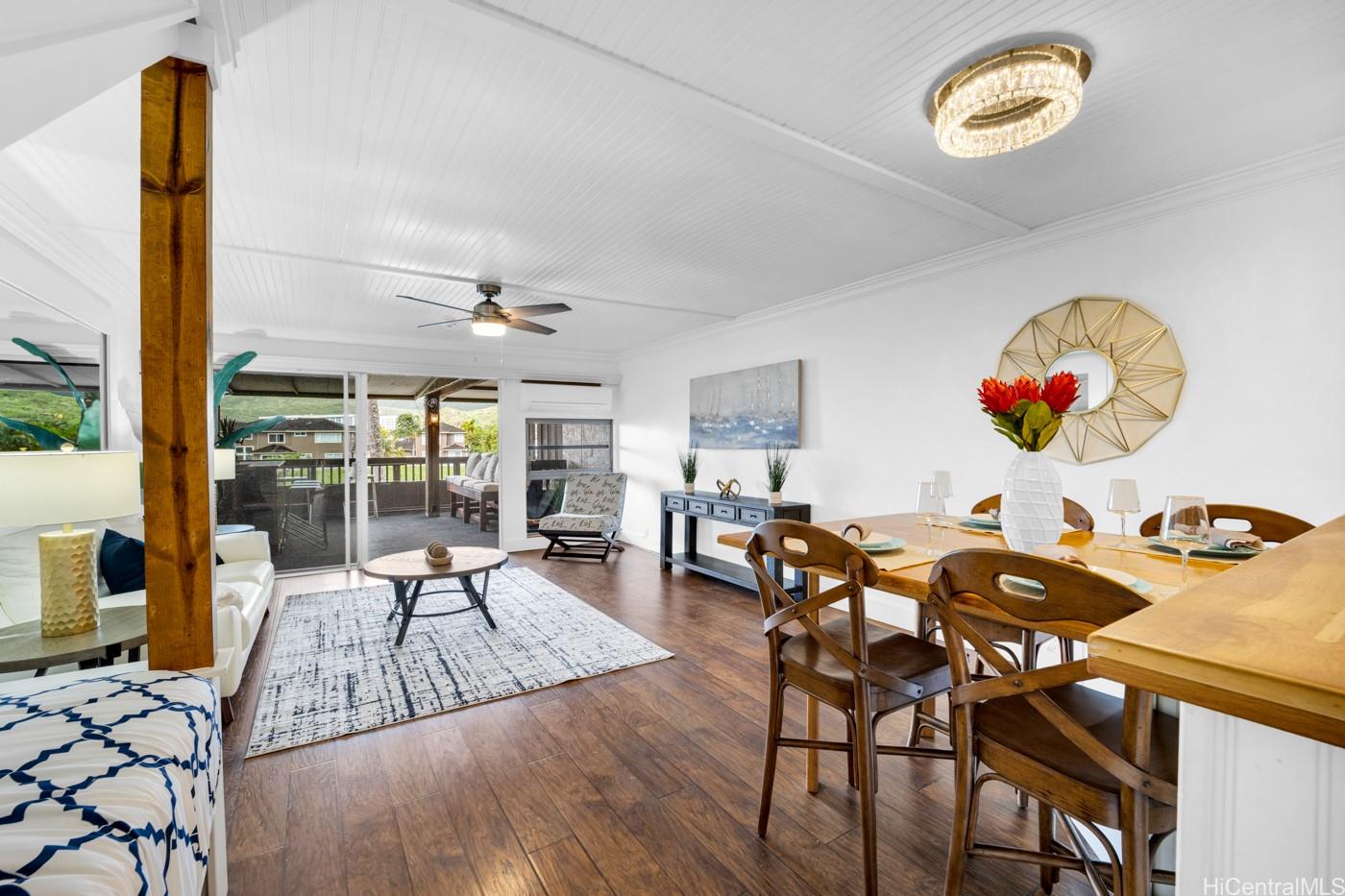 444 Lunalilo Home Road, Unit 325 Honolulu, HI 96825 - Photo 1 of 1 a view of a dining room with furniture and chandelier