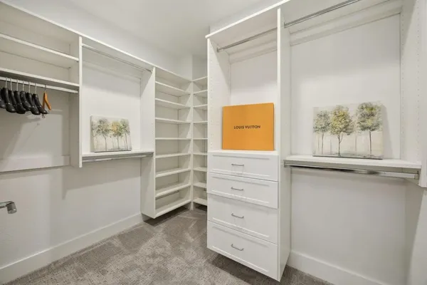 a view of an empty walk in closet
