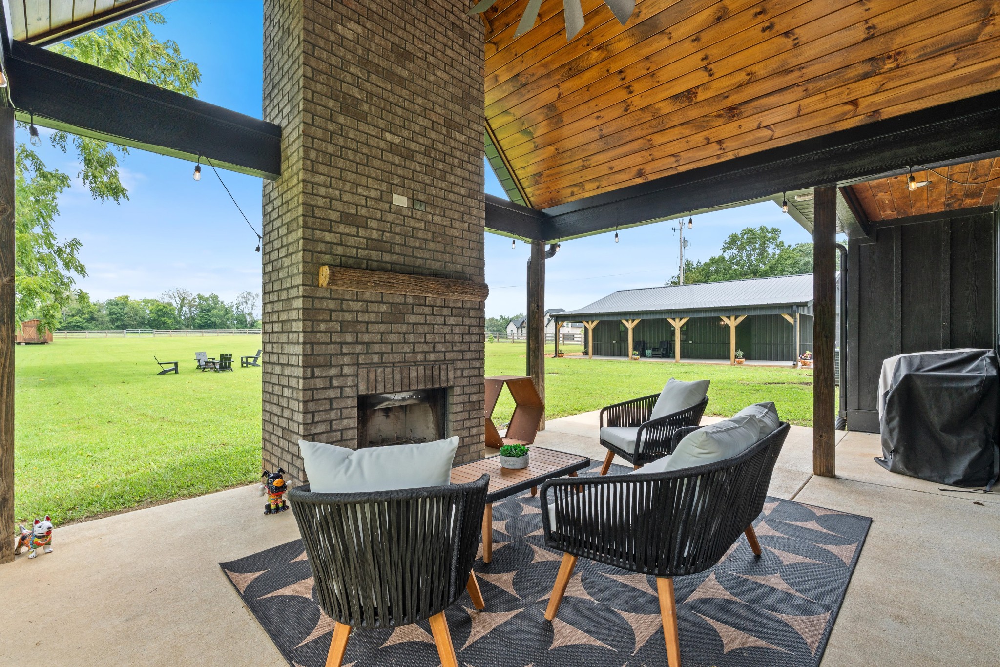 290 Dink Rut Road Portland, TN 37148 - Photo 51 of 66 a view of a patio with table and chairs and potted plants