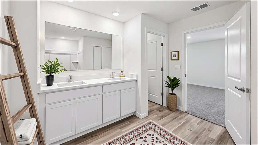 6022 Knickerbocker Street Mableton, GA 30126 - Photo 5 of 11 a spacious bathroom with a double vanity sink and a mirror