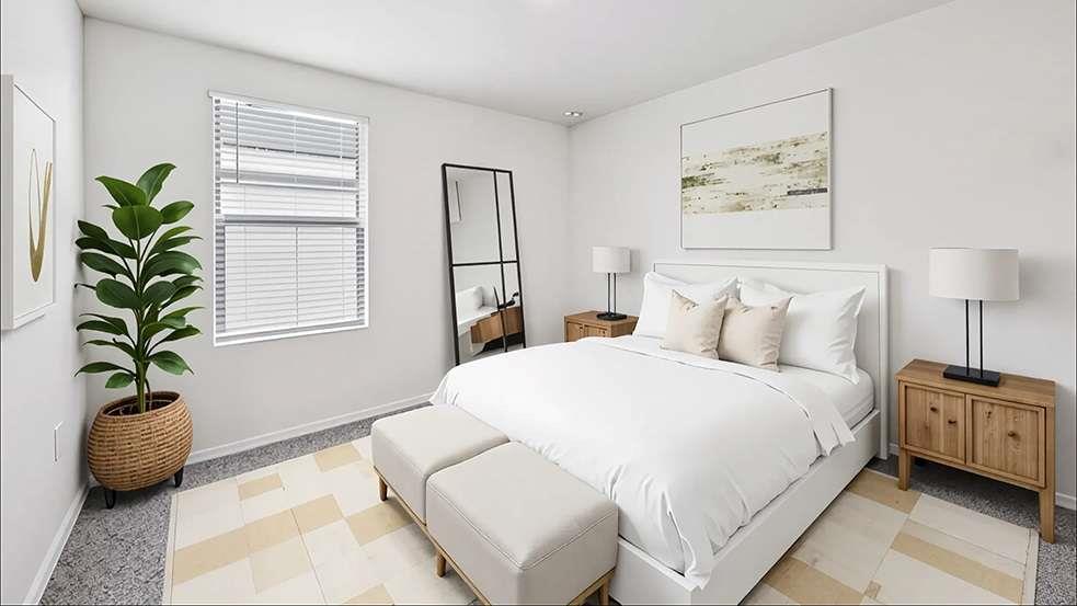 6022 Knickerbocker Street Mableton, GA 30126 - Photo 7 of 11 a bedroom with a bed a couch and a potted plant