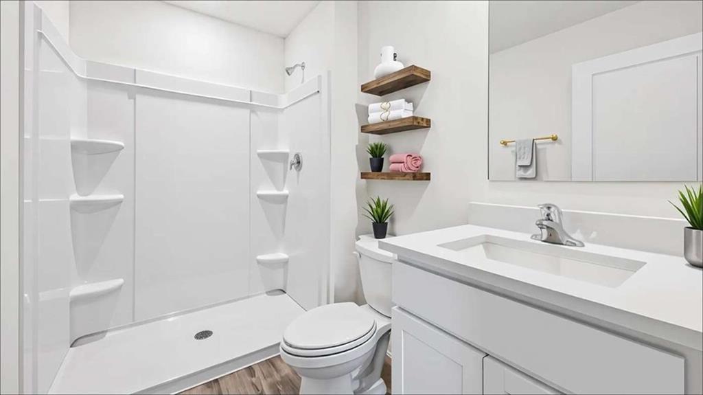 6022 Knickerbocker Street Mableton, GA 30126 - Photo 8 of 11 a bathroom with a sink toilet and shower