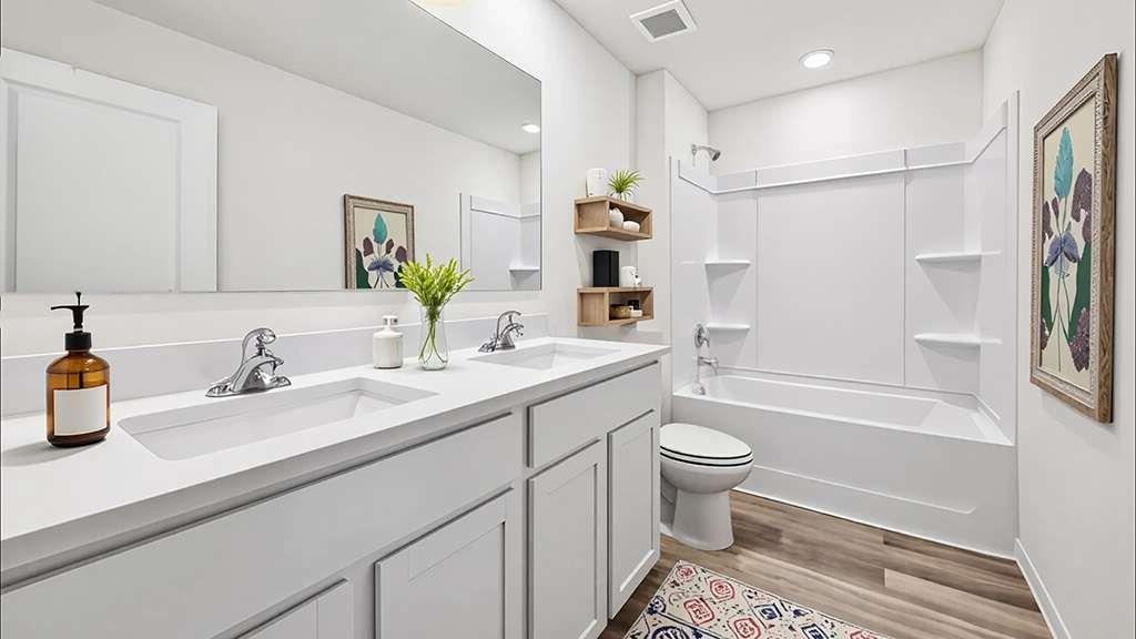6022 Knickerbocker Street Mableton, GA 30126 - Photo 10 of 11 a bathroom with a sink a toilet and shower