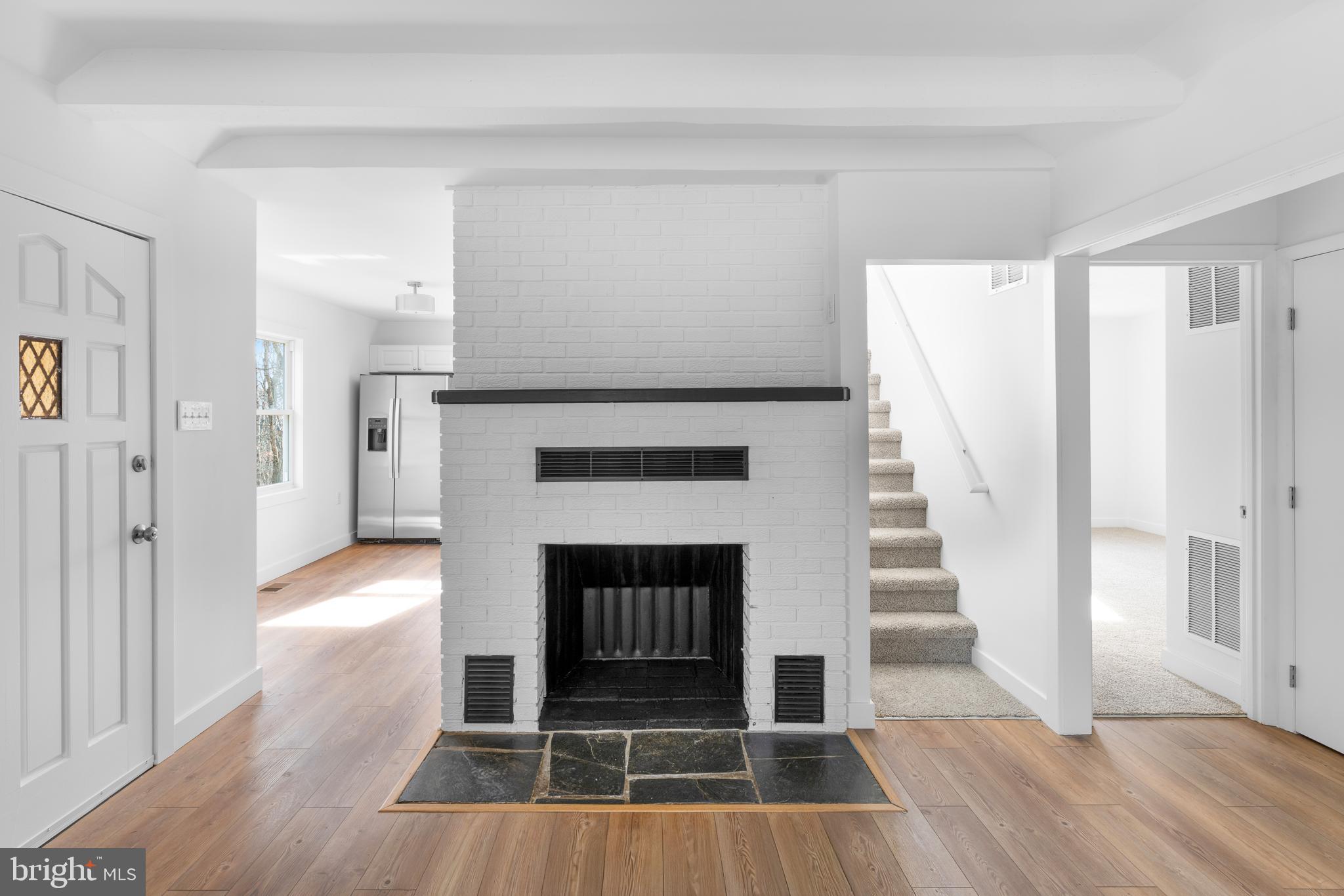 351 Ridgeview Road Gore, VA 22637 - Photo 16 of 31 a living room with wooden floor and a fireplace