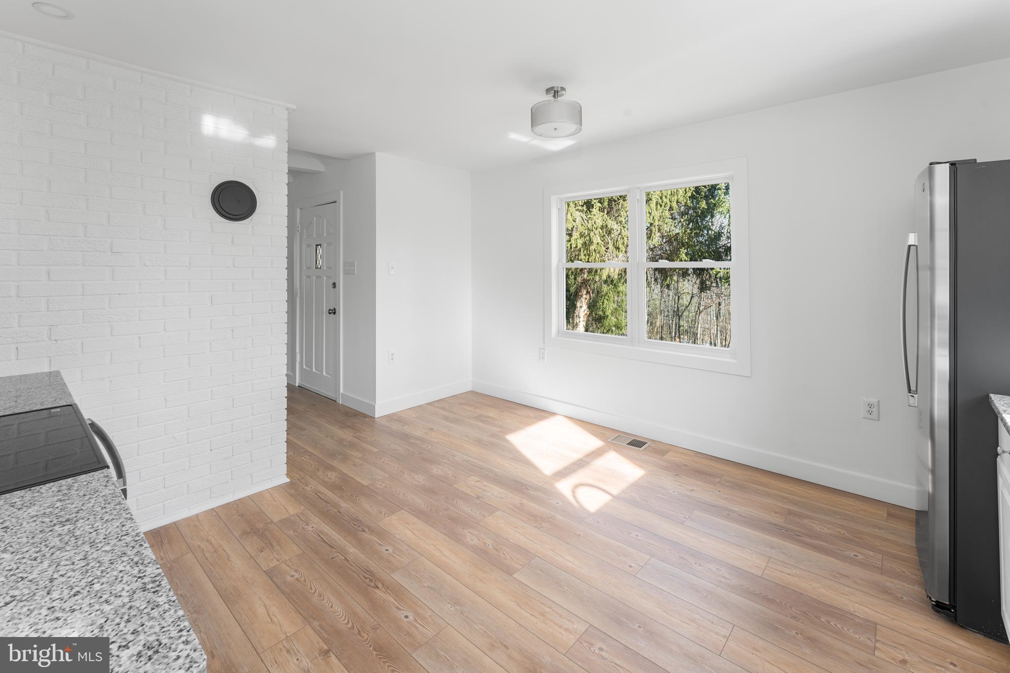 351 Ridgeview Road Gore, VA 22637 - Photo 23 of 31 a view of an empty room with wooden floor and a window