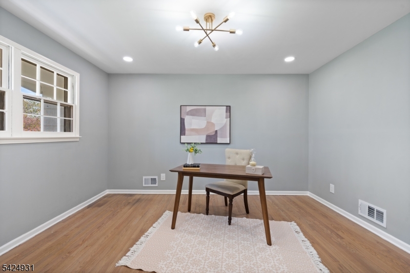 22 Hillcrest Road Hillsborough, NJ 08844 - Photo 11 of 35 a workspace with furniture and wooden floor