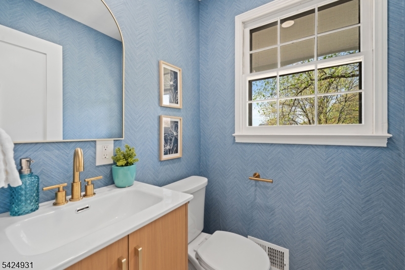 22 Hillcrest Road Hillsborough, NJ 08844 - Photo 12 of 35 a bathroom with a toilet sink and mirror