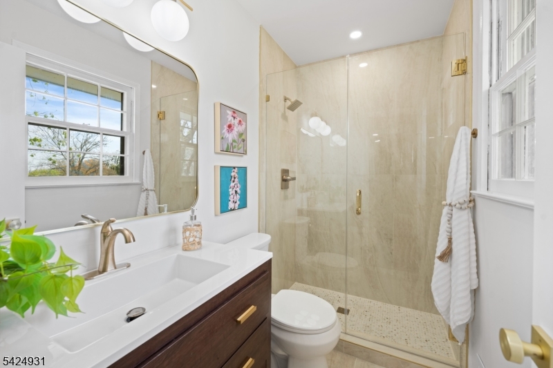 22 Hillcrest Road Hillsborough, NJ 08844 - Photo 14 of 35 a bathroom with a sink toilet and shower