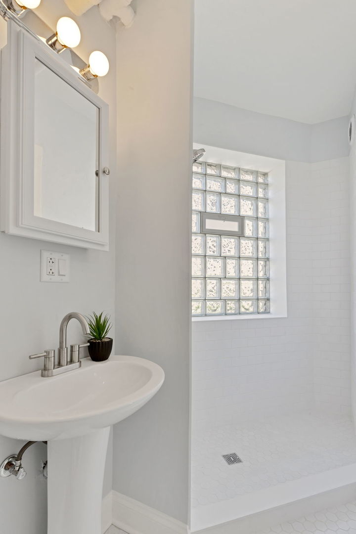 1001 Washington Street Evanston, IL 60202 - Photo 9 of 13 a bathroom with a sink and vanity