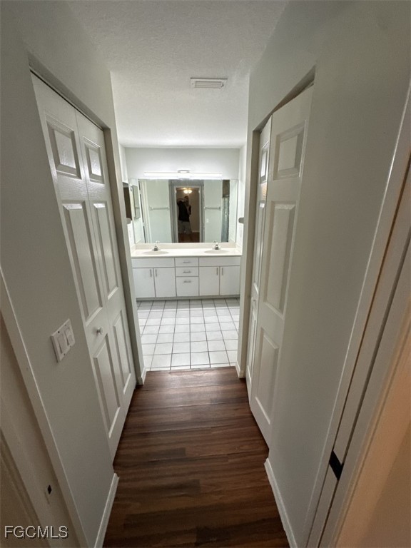 2400 Leavitt Road Alva, FL 33920 - Photo 16 of 26 a view of a hallway with wooden floor and stairs