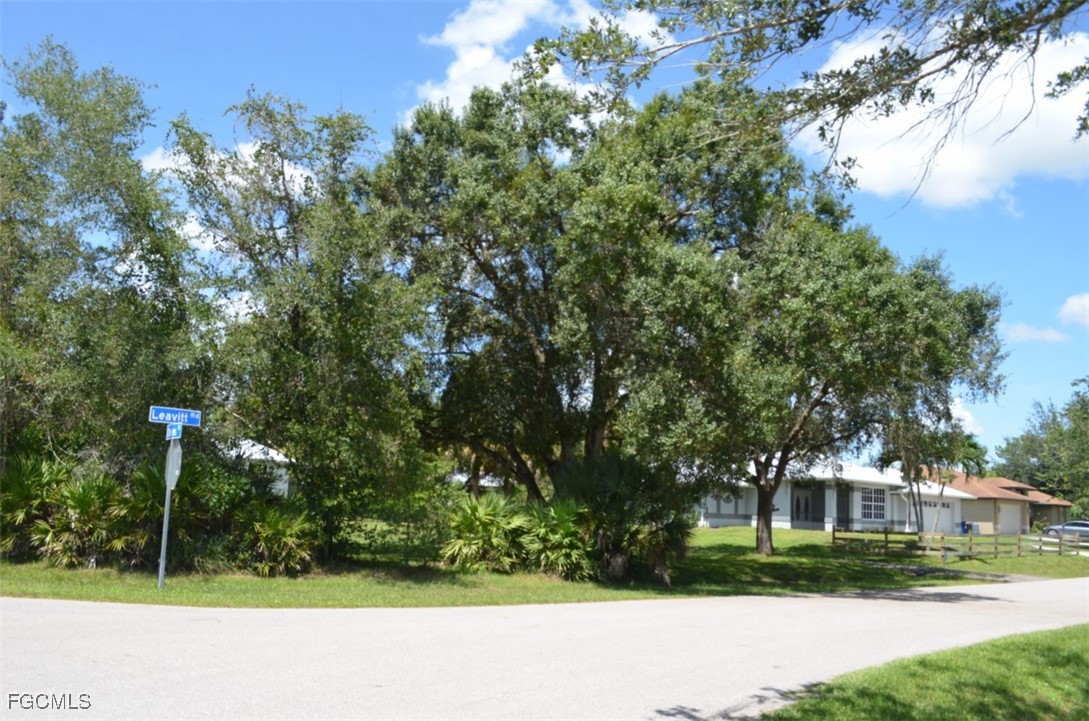 2400 Leavitt Road Alva, FL 33920 - Photo 6 of 26 a view of street with a building and trees in the background