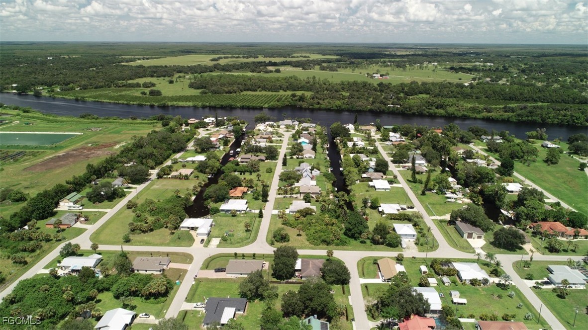 2400 Leavitt Road Alva, FL 33920 - Photo 10 of 26 an aerial view of residential houses with outdoor space and lake view