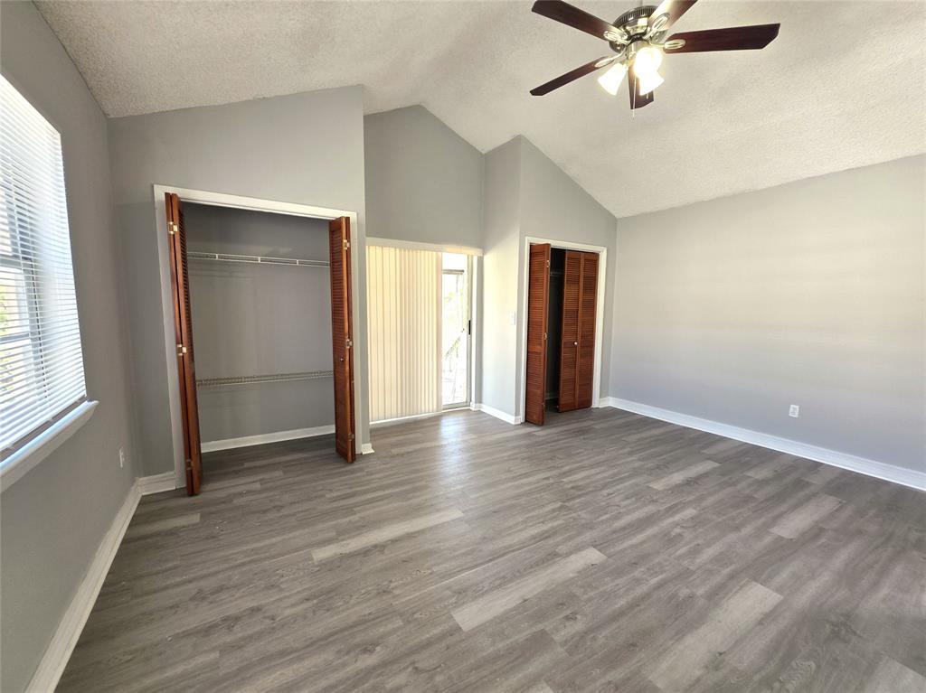 11951 Southwest 271st Terrace Homestead, FL 33032 - Photo 8 of 25 an empty room with wooden floor closet and windows