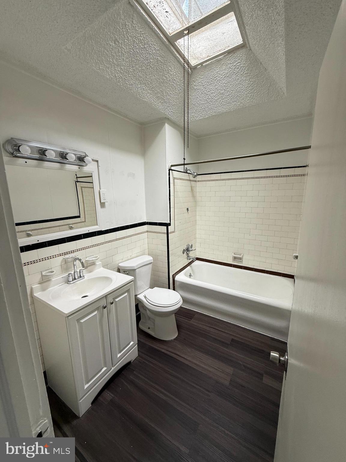 6921 Clinton Road Upper Darby, PA 19082 - Photo 8 of 17 a bathroom with a sink mirror and vanity