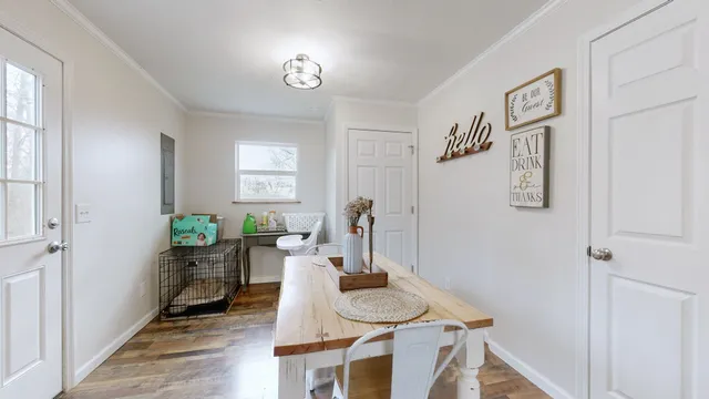 a view of a dining room with furniture window and wooden floor