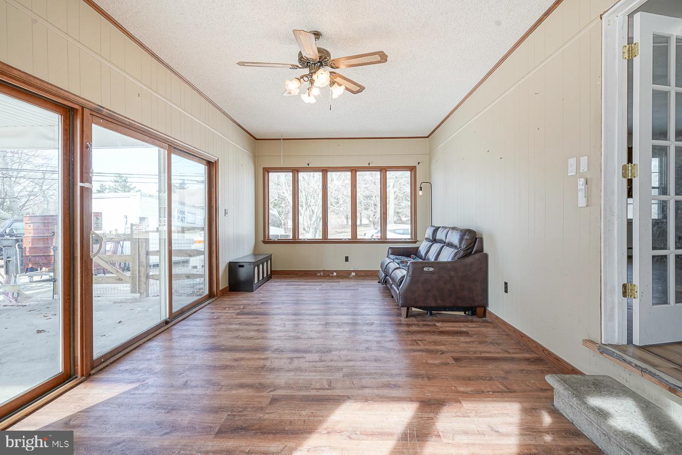 462 Carvin Street Clayton, NJ 08312 - Photo 18 of 29 a living room with furniture and a large window with outer view