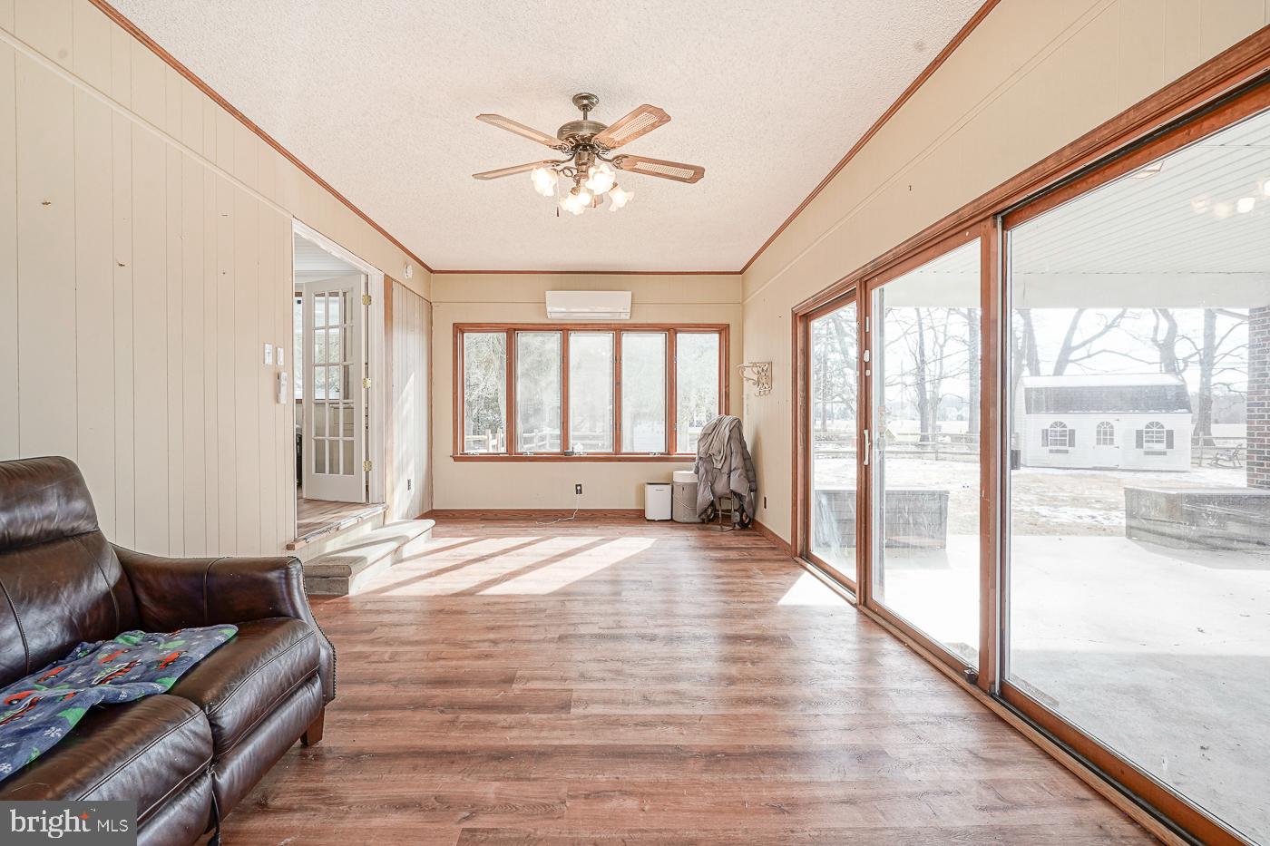 462 Carvin Street Clayton, NJ 08312 - Photo 19 of 29 a living room with furniture and floor to ceiling windows