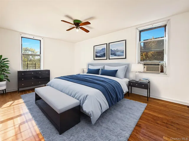 a bedroom with bed and window