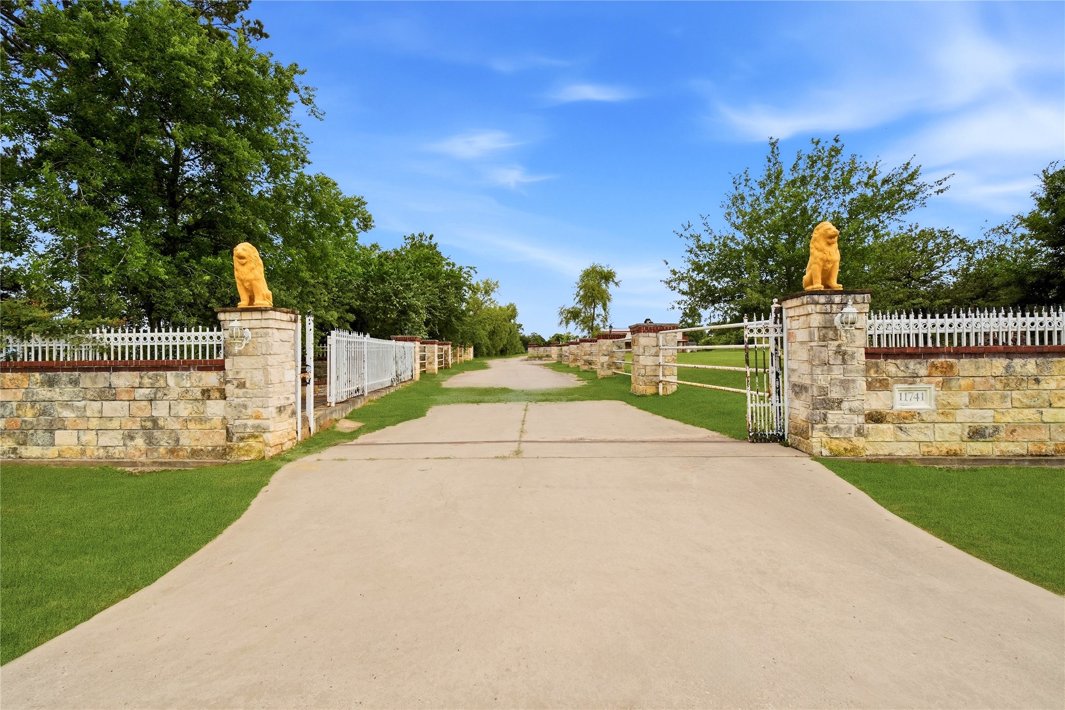 11741 Ezekiel Road Tomball, TX 77375 - Photo 1 of 30 a white house with a yard and big trees