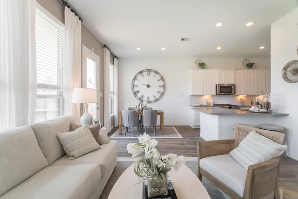 a view of a dining room with furniture and a window