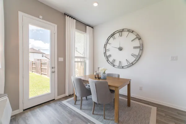 a living room with furniture a large window and a flat screen tv