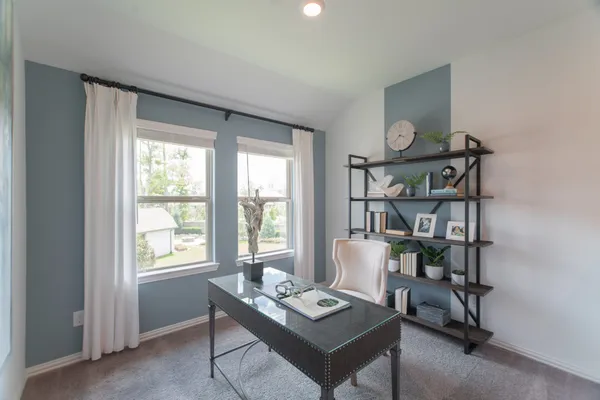 a view of a workspace with furniture