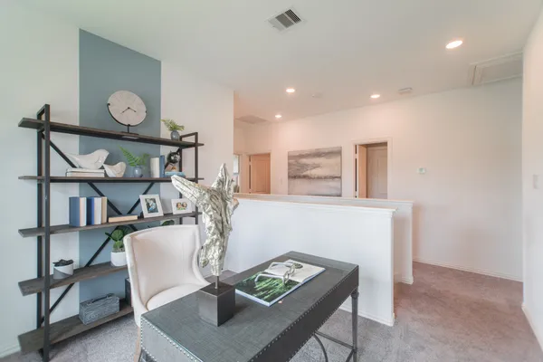 a bedroom with a bed and a couch