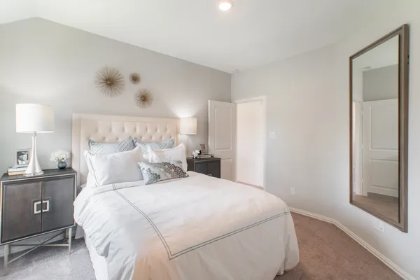 a bathroom with a sink double vanity mirror and a bathtub