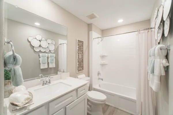 a bedroom with a bed and cabinets