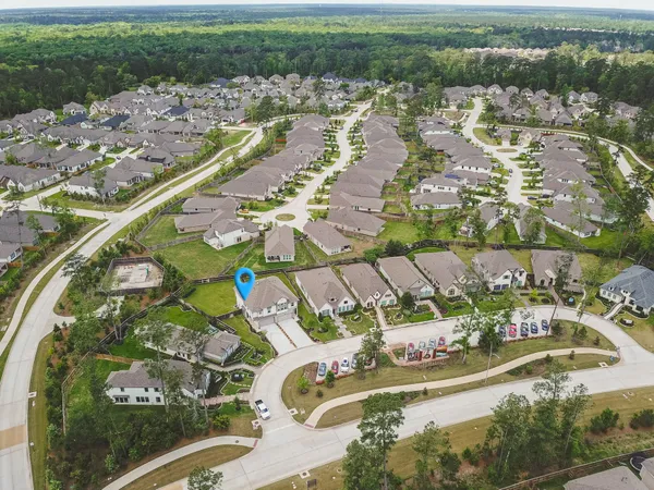 an aerial view of residential houses with outdoor space