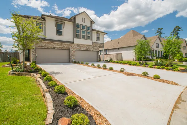 a view of an house with backyard and tree