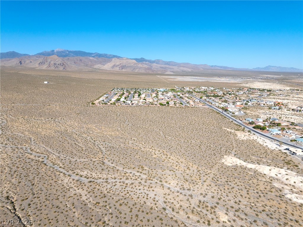 3440 Winery Road Pahrump, NV 89048 - Photo 9 of 12 Aerial view from West side of property looking East towards the Vineyards with Mt Charleston in the background.