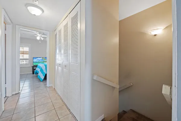 a bedroom with a bed a table and chair