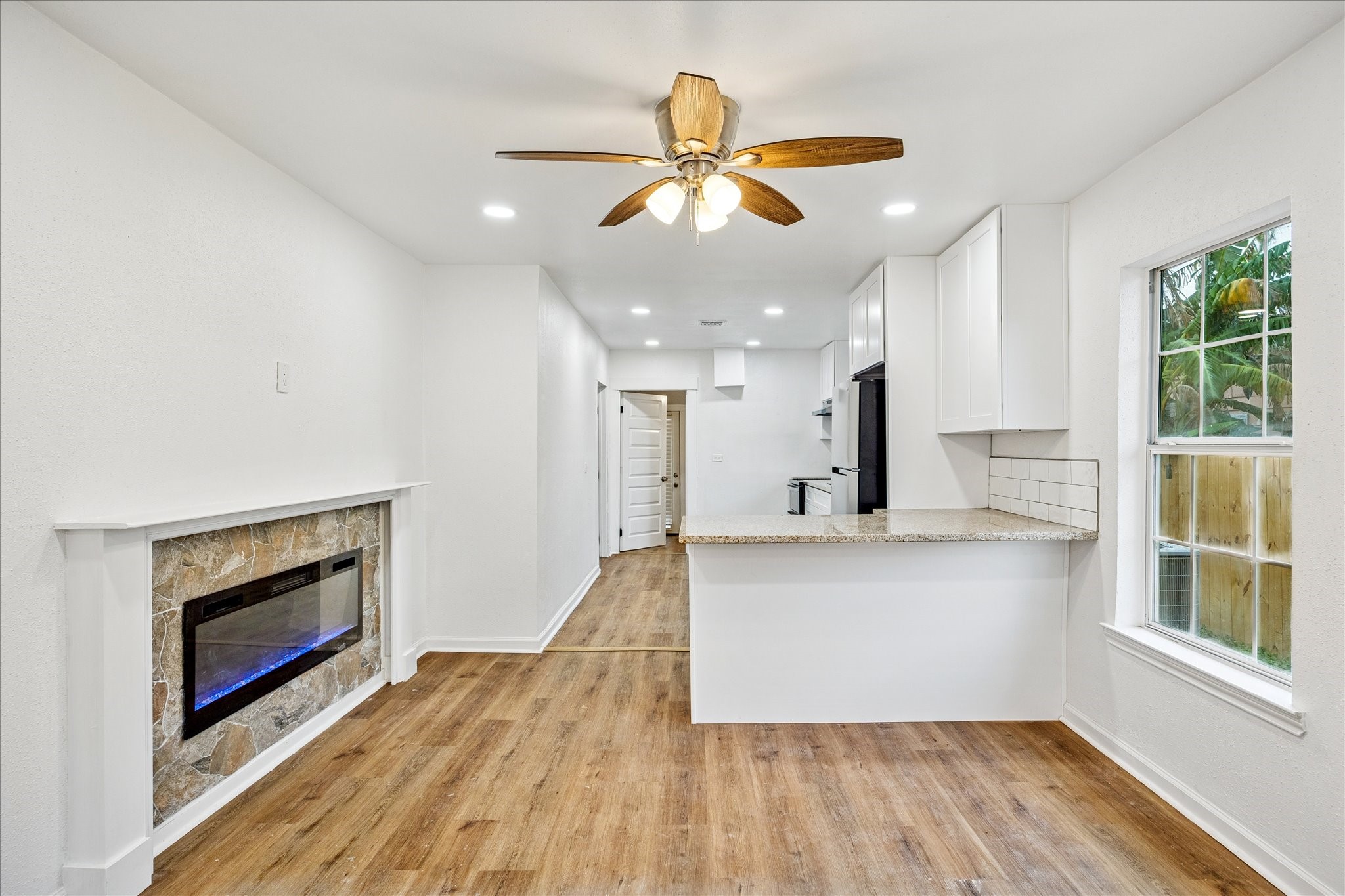 1803 Simpson Street Houston, TX 77020 - Photo 2 of 10 a view of kitchen with cabinets and wooden floor
