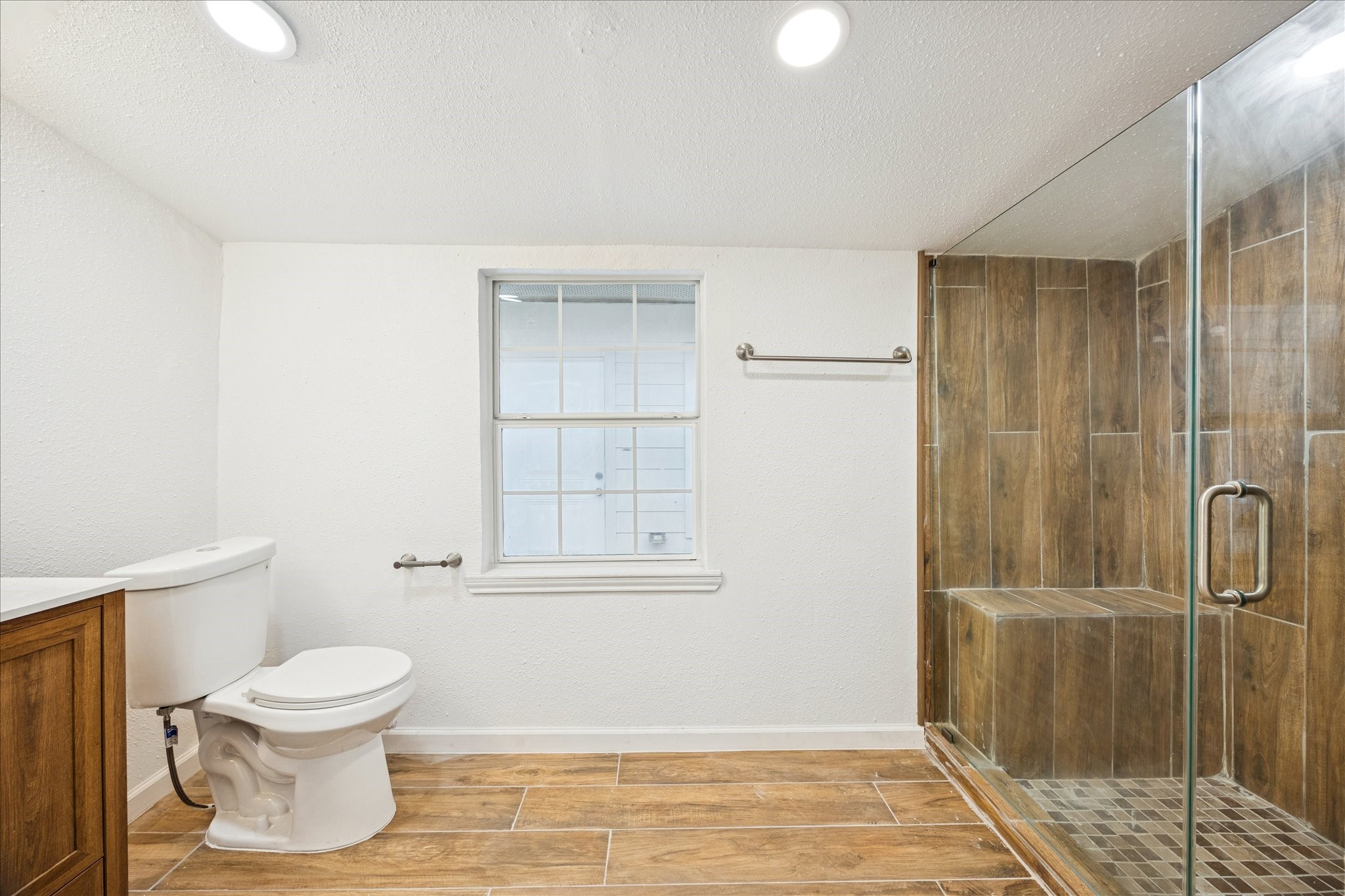 1803 Simpson Street Houston, TX 77020 - Photo 7 of 10 a bathroom with a toilet and a shower