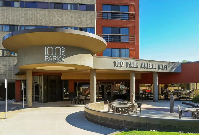 a view of a building with sitting area