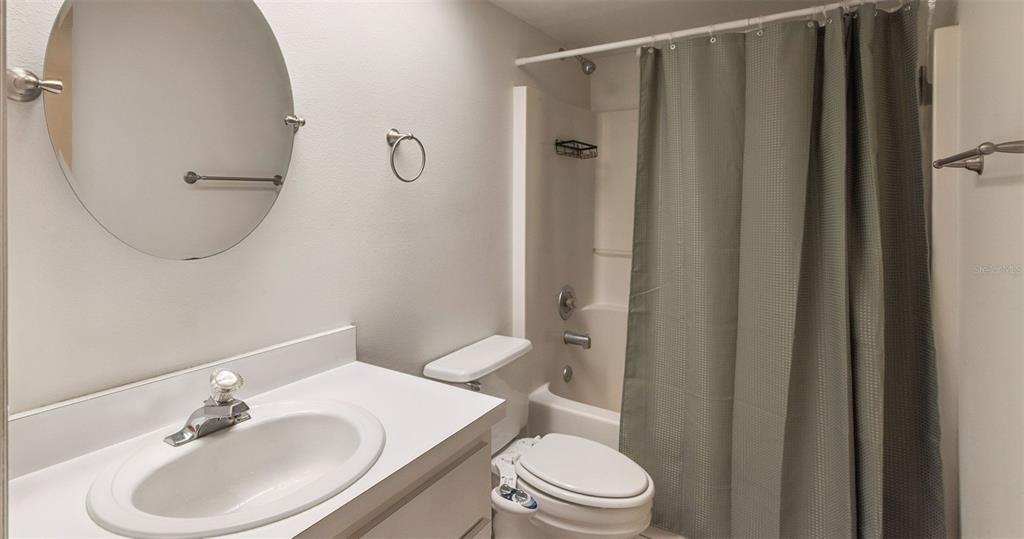 30911 Vista View Mount Dora, FL 32757 - Photo 26 of 54 a bathroom with a sink toilet and shower