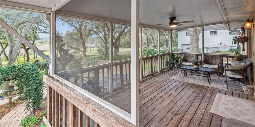 30911 Vista View Mount Dora, FL 32757 - Photo 28 of 54 a balcony with chairs and wooden floor