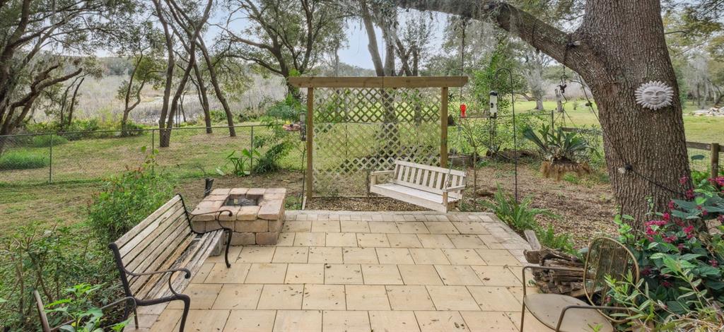30911 Vista View Mount Dora, FL 32757 - Photo 4 of 54 a view of a bench in the garden