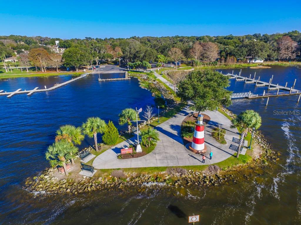 30911 Vista View Mount Dora, FL 32757 - Photo 50 of 54 an aerial view of residential houses with outdoor space and river
