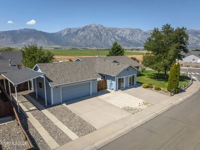 a aerial view of a house with a yard and a large window