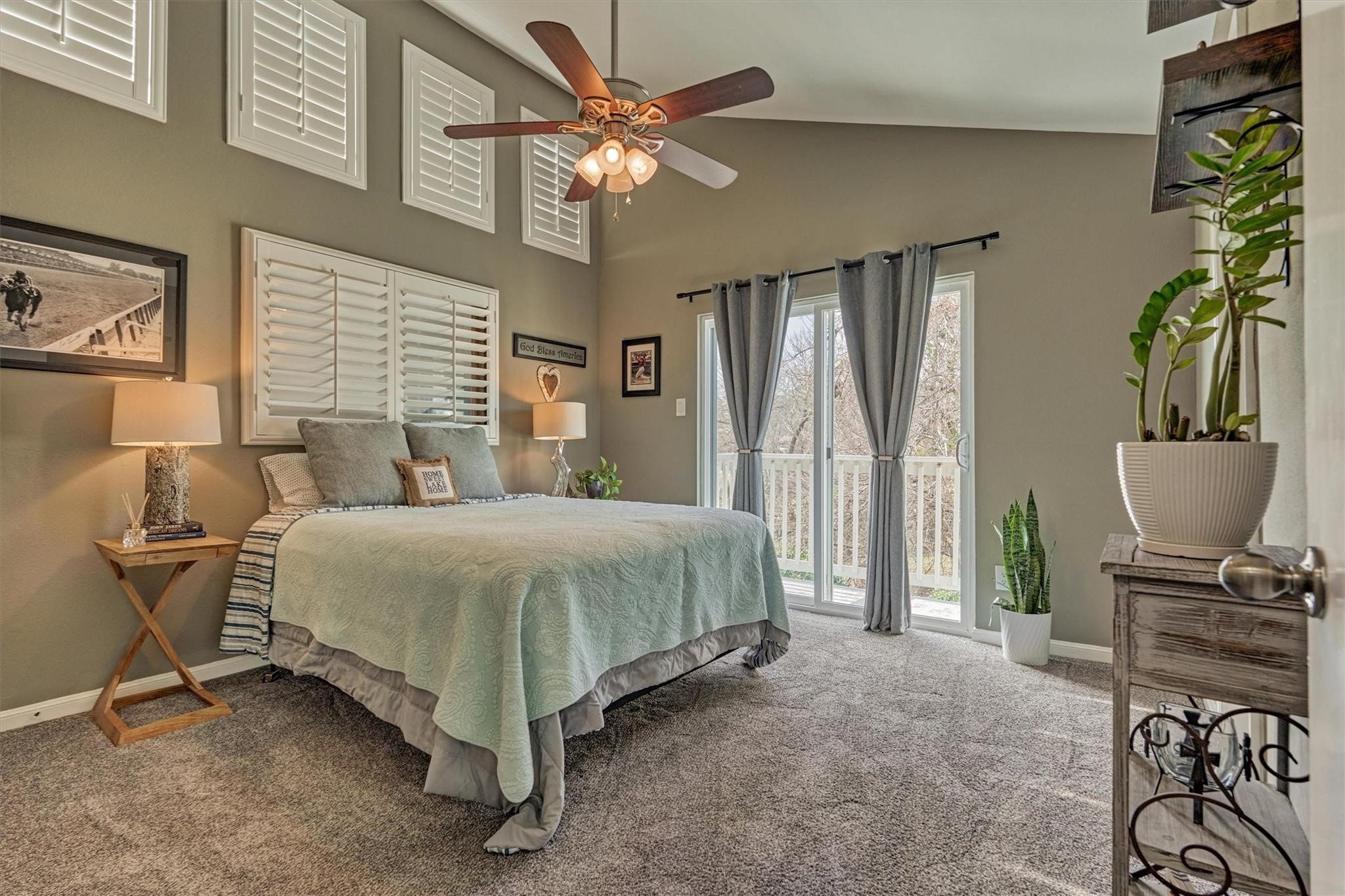 1 April Point Drive South Montgomery, TX 77356 - Photo 25 of 45 a bedroom with a bed and a chair with the potted plants