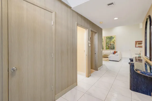 a view of a bedroom with furniture and windows