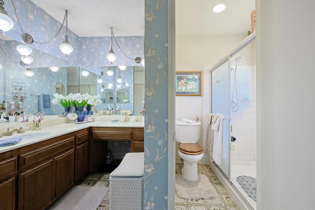 740 South Grade Road Alpine, CA 91901 - Photo 13 of 31 a bathroom with a sink a toilet and shower