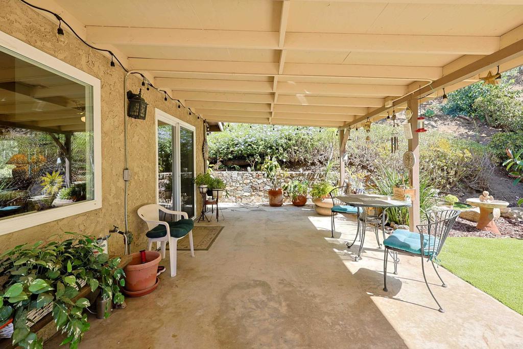 740 South Grade Road Alpine, CA 91901 - Photo 20 of 31 a view of a patio with table and chairs and potted plants